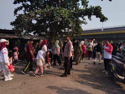 Polsek Muara Harus Amankan Kegiatan Jalan Sehat HUT RI Ke-81 di Desa Manduin